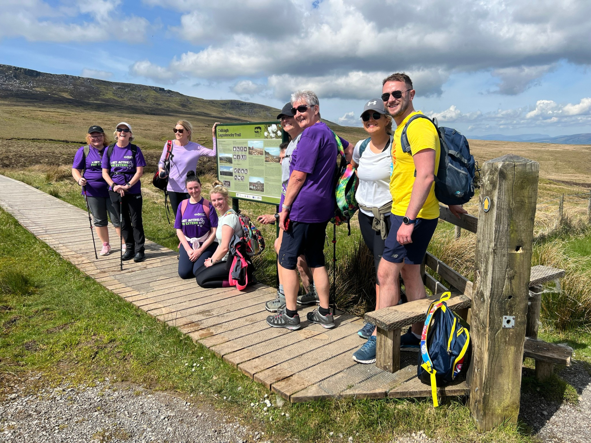 Extern staff walking with service users in the countryside