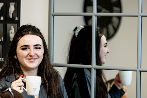 Young person drinking a cup of tea