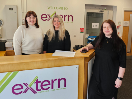 Three Extern staff standing at service counter