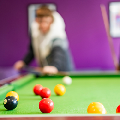 Young male playing pool