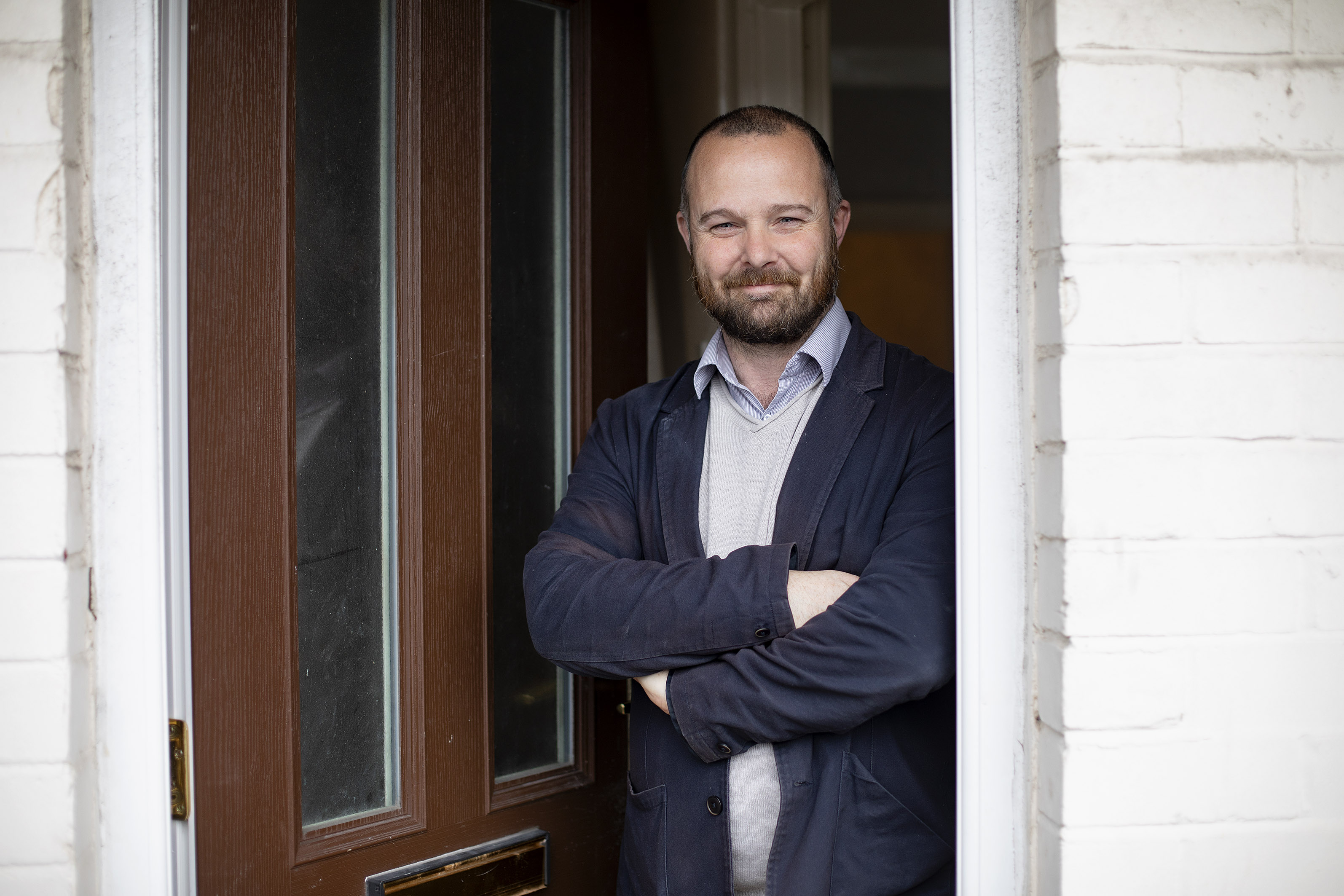 Declan Morris standing outside an Extern Home